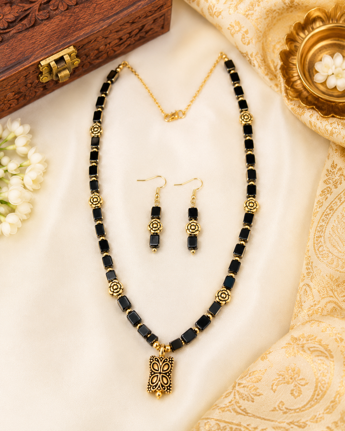 Black rectangular beads with Gold Accents